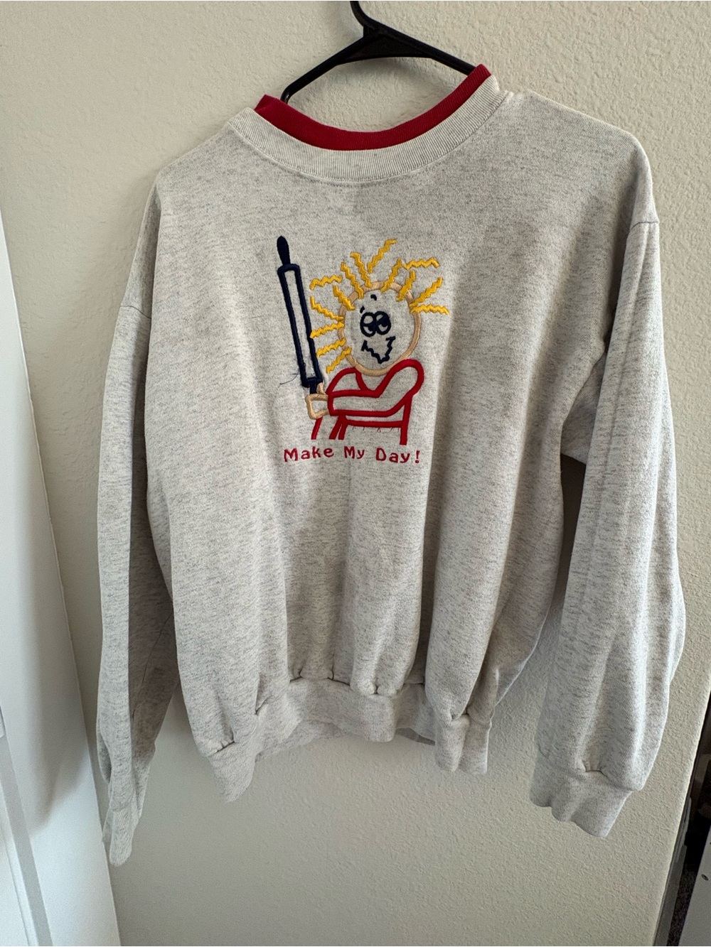 Light Gray Crewneck Sweater with Red Trim and Embroidered Graphic